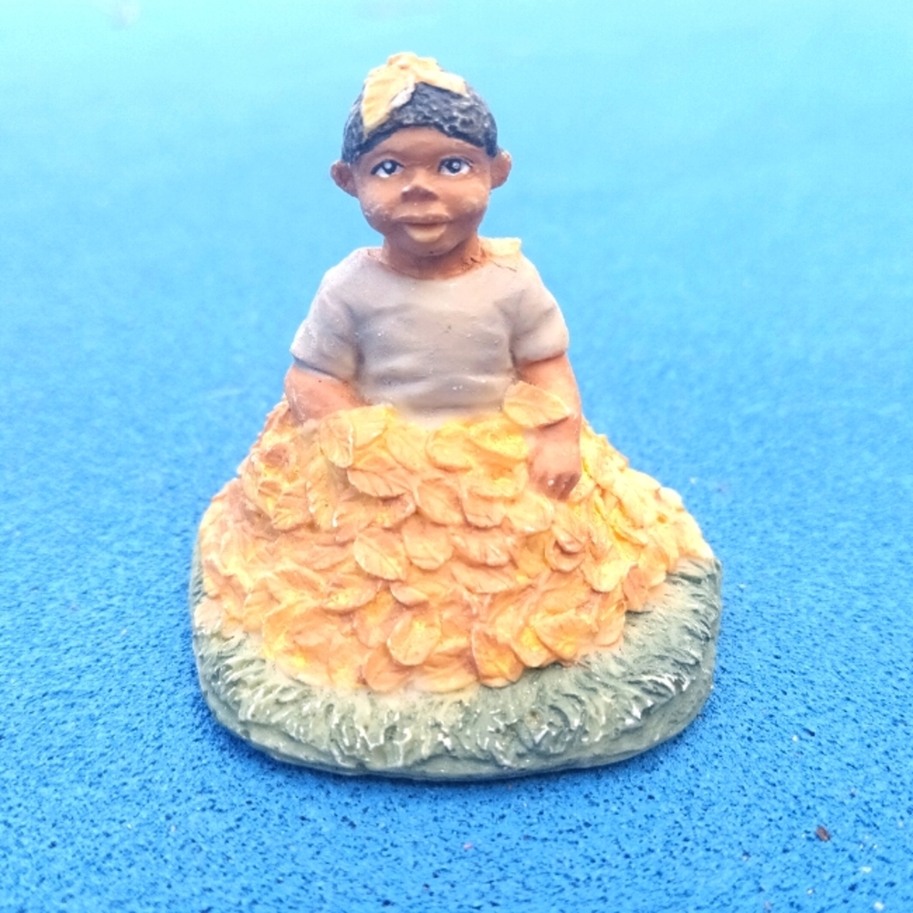 Vintage Ceramic Little Brown Child Playing In Leaf Pile Figurine